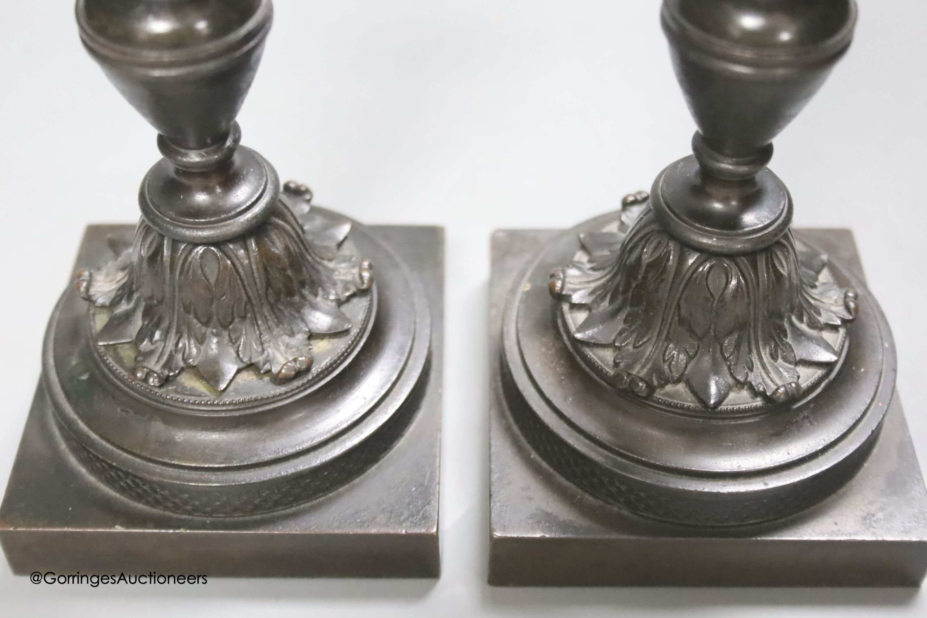 A pair of 19th century French bronze dwarf candlesticks, height 17cm